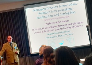 Photo of John Packer speaking